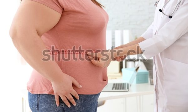 female-doctor-measuring-waist-overweight-600w-1115769623-2