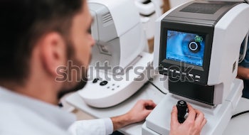 handsome-male-doctor-ophthalmologist-checking-600w-1040460661-2